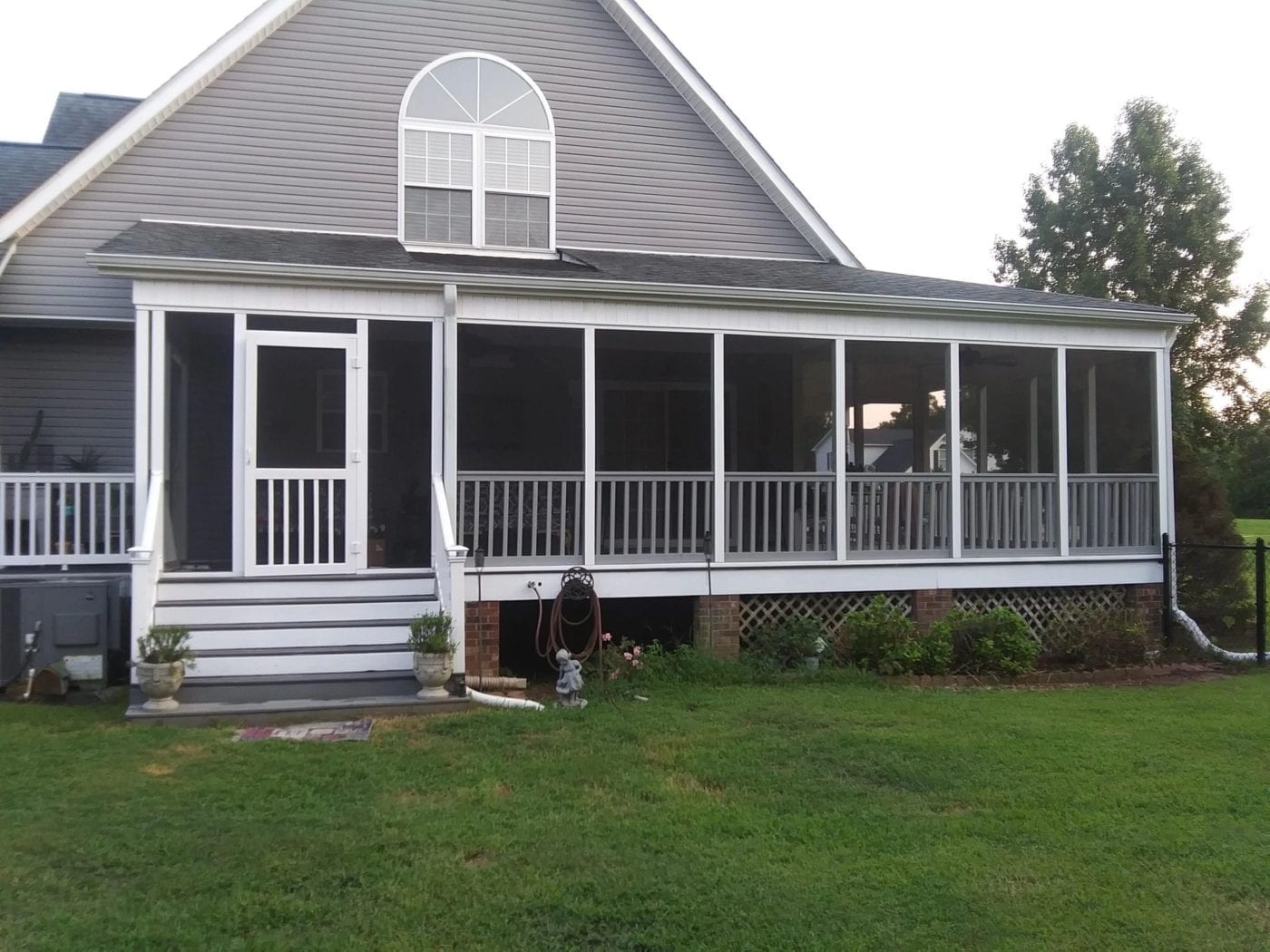 Wrap Around Screen Porch with Five Bar Vinyl Door